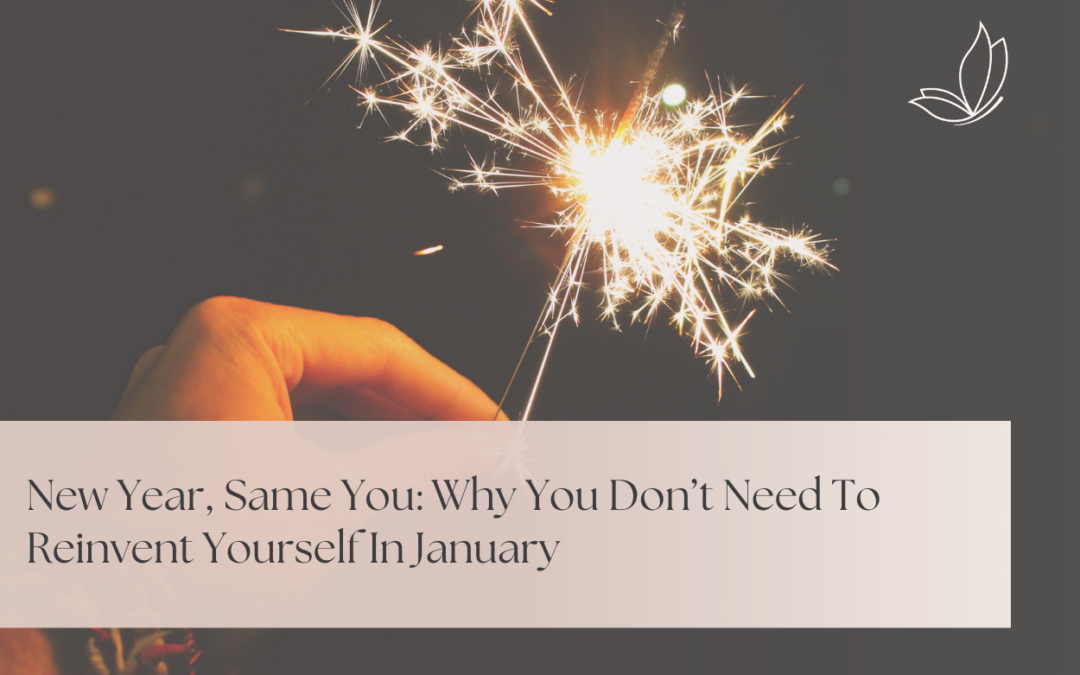 Hand holding a lit sparkler against a dark background, representing reflection and gentle new beginnings for Goal Setting Therapy in Sherwood Park.